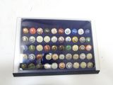 a box with many different colored buttons in it
