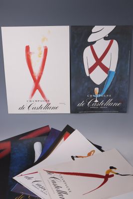 several posters of various types of clothing are displayed on a table