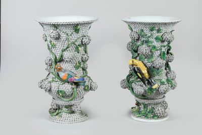 two vases that have birds on them on them