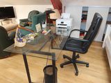 an image of a living room with a desk and chair