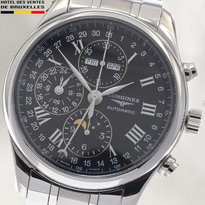 a close up of a watch with roman numerals on the face