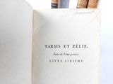 an open book with a bunch of books on top of it