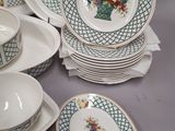 a lot of plates and bowls that are on the table