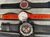 two watches sitting next to each other in a box