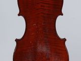 an old violin with a wooden back and a wooden bow