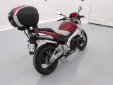 a red and white motorcycle with a helmet on it
