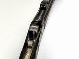 a close up of a rifle on a white surface with a white background