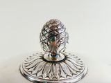 an image of a silver plate with a pineapple on it