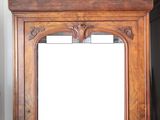 a mirror that is sitting on top of a cabinet