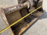 a close up of a large metal object with a tape on it