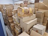 many boxes stacked on top of each other in a room