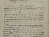 an old document with writing on it sitting on top of a table