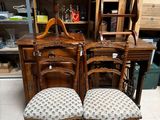 two chairs that are sitting next to a table