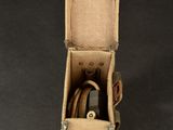a small box with a cord in it on a table