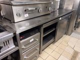 a kitchen with a lot of stainless steel appliances in it