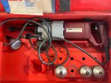 a red box with a bunch of tools inside of it