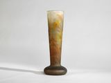a glass vase that is sitting on a table
