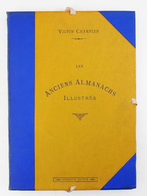 un vieux livre à la couverture bleue et jaune posé sur une table blanche