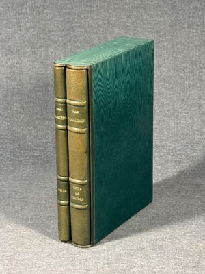 two green books sitting on top of each other on a gray surface