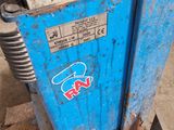 a close up of a blue machine with a sticker on it