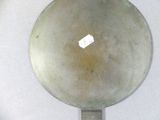 an old frying pan with a sticker on it