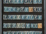 une image représentant une collection de timbres dans un cadre vitré