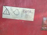 a red gas tank with a sticker on it