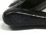 a close up of a black object on a white surface