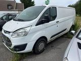 a white van that is parked in a parking lot