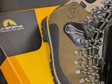 a pair of hiking shoes that are on top of a box