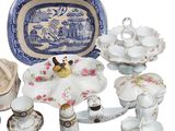 many different pieces of china on display on the table