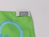 a green bag with a picture of a headphone on it