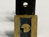 a small metal object with a hole in the middle