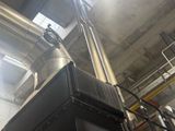 a picture of a large metal pipe in a building