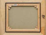 a close up of a picture frame with a key on it