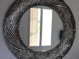 a mirror hanging on the wall in a room