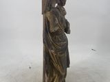 bronze statue of a woman holding a bird on her shoulder