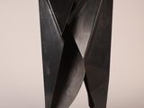 an image of a black sculpture on a white surface