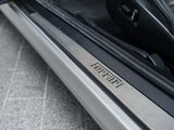 a close up of a car door sill with the word ferrari written on it