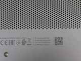 the back side of a silver laptop computer with a metal cover