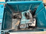 a blue tool box with tools in it on the floor