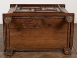 a wooden box with a glass door on top of it