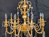 an image of a chandelier made of brass and crystal beads