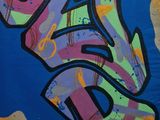 graffiti on the side of a building with a fire hydrant in front of it