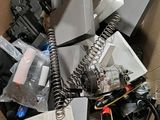 a cardboard box filled with electronic equipment and wires