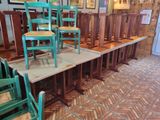 many chairs that are lined up on the floor