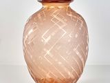 a glass vase that is sitting on a table