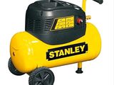 un compresseur d'air jaune et noir posé sur un chariot