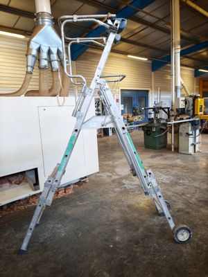a ladder that is sitting in the middle of a room