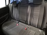 the back seats of a car are black and grey in color